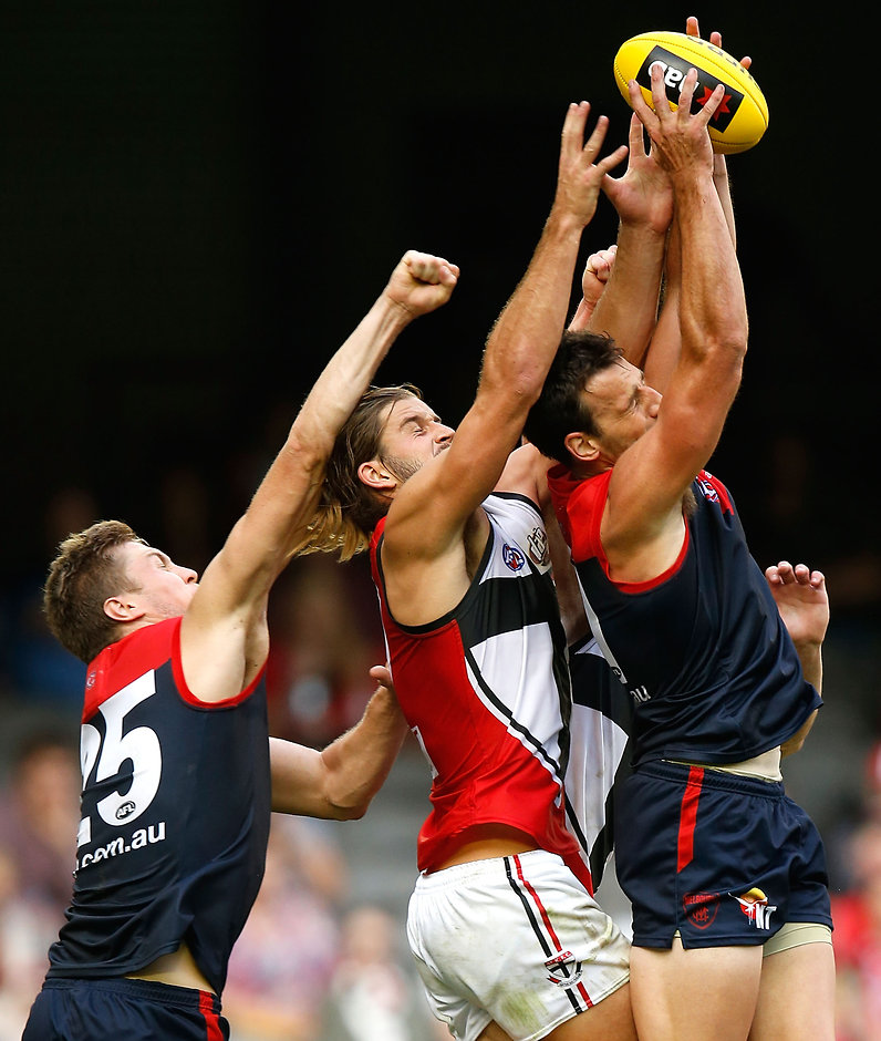 AFL 2016 NAB Challenge - Melbourne v St Kilda MELBOURNE, AUSTRALIA - MARCH 13: (L-R) Tom McDonald of the Demons, Josh Bruce of the Saints and Cameron Pedersen of the Demons compete for the ball during the 2016 NAB Challenge match between the Melbourne Demons and the St Kilda Saints at Etihad Stadium, Melbourne on March 13, 2016. (Photo by Michael Willson/AFL Media)